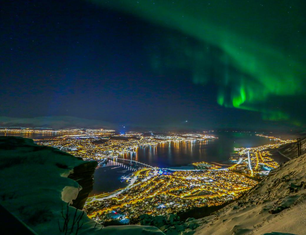 Tromsø in northern lights in winter-Yngve Olsen - Visit Norway 